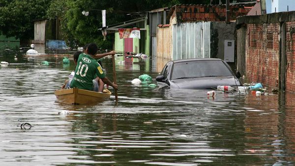 Residents row their boat in a neighbourhood flooded by the Acre river, which continues to rise from weeks of heavy rainfall in the region including northern Bolivia, in Rio Branco, Acre state Residents row their boat in a neighbourhood flooded by the Acre river, which continues to rise from weeks of heavy rainfall in the region including northern Bolivia, in Rio Branco, Acre state - Sputnik International