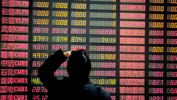 A man reacts as he looks at the stock price monitor at a private securities company Monday, March 16, 2009 in Shanghai, China. A man reacts as he looks at the stock price monitor at a private securities company Monday, March 16, 2009 in Shanghai, China. - Sputnik International