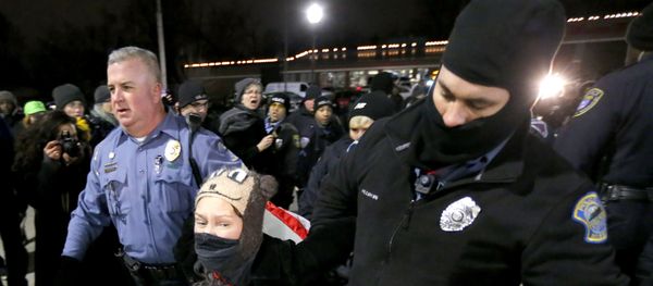 Ferguson, Mo., police officers take into custody a protester who was warned several times not to block the street outside the police station Ferguson, Mo., police officers take into custody a protester who was warned several times not to block the street outside the police station - Sputnik International