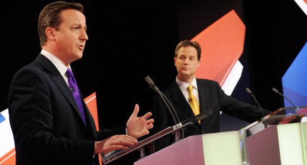 Conservative leader David Cameron, left, and Liberal Democrat Party leader Nick Clegg, centre, take part in Britain's second televised election debate in Bristol, England, Thursday, April 22, 2010. - Sputnik International