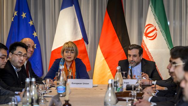 EU political director Helga Schmid (CL) seats next to Iran's deputy foreign minister Abbas Araqchi (R) at the opening of nuclear talks between Iran and Members of the P5+1 group on March 5, 2015 in Montreux EU political director Helga Schmid (CL) seats next to Iran's deputy foreign minister Abbas Araqchi (R) at the opening of nuclear talks between Iran and Members of the P5+1 group on March 5, 2015 in Montreux - Sputnik International