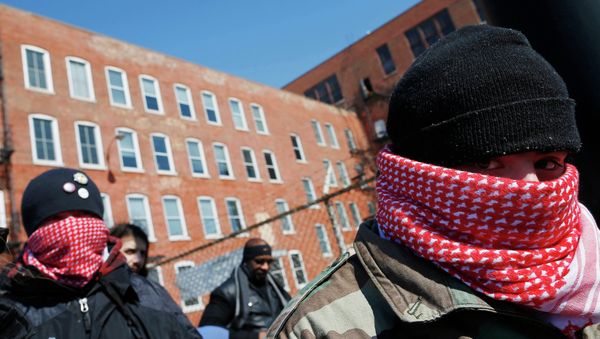 Protestors gather outside a police facility called Homan Square, demanding an investigation into a media report denied by police that the site functions as an off-the-books interrogation compound, in Chicago, Illinois, March 5, 2015 - Sputnik International