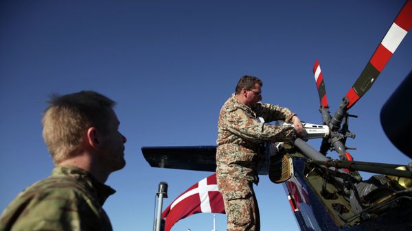 Danish soldiers from the Royal Danish Navy work at an helicopter onboard of the Absalon military ship in the Cypriot port city of Limassol - Sputnik International
