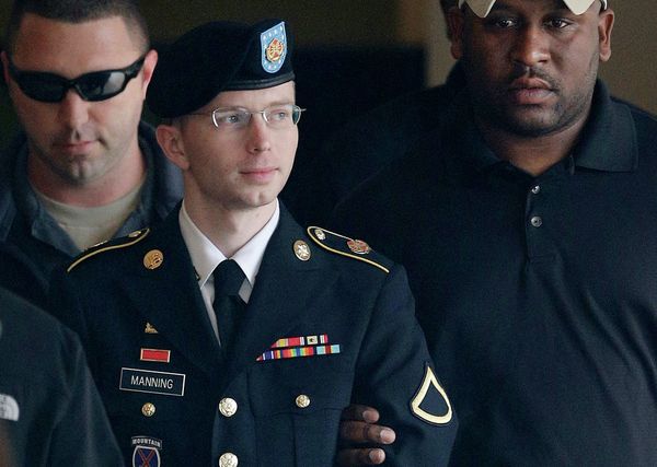 Army Pfc. Bradley Manning (now Chelsea Manning) is escorted to a security vehicle outside a courthouse in Fort Meade, Md., after a hearing in his court martial.  - Sputnik International