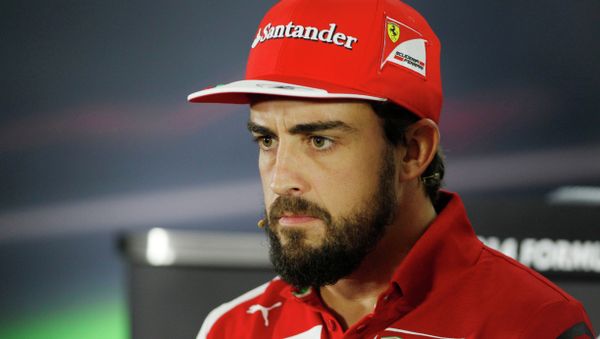 Ferrari driver Fernando Alonso of Spain answers to reporters during a news conference at the Yas Marina racetrack in Abu Dhabi, United Arab Emirates, Thursday, Nov. 20, 2014. Two-time Formula One champion Fernando Alonso is leaving Ferrari after the final race of the season and will be replaced by four-time champion Sebastian Vettel. The 33-year-old Spanish driver had said earlier this season that his future was elsewhere, likely at McLaren. - Sputnik International