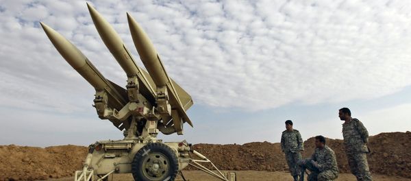 In this photo obtained from the Iranian Mehr News Agency, Iranian army members prepare missiles to be launched, during a maneuver, in an undisclosed location in Iran In this photo obtained from the Iranian Mehr News Agency, Iranian army members prepare missiles to be launched, during a maneuver, in an undisclosed location in Iran - Sputnik International