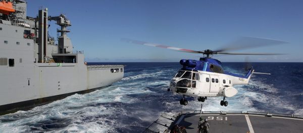 United States Navy Ship (USNS) Cesar Chavez's Super Puma helicopter, conducts a Vertical Replenishment between HMAS Toowoomba, during Operation Southern Indian Ocean, in search of missing Malaysia Airlines Flight MH370 United States Navy Ship (USNS) Cesar Chavez's Super Puma helicopter, conducts a Vertical Replenishment between HMAS Toowoomba, during Operation Southern Indian Ocean, in search of missing Malaysia Airlines Flight MH370 - Sputnik International