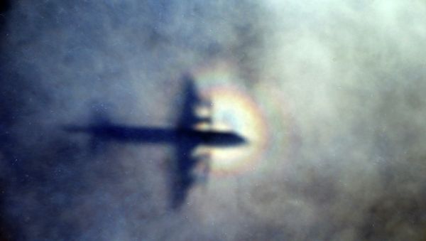 The shadow of a Royal New Zealand Air Force P3 Orion is seen on low level cloud while the aircraft searches for missing Malaysia Airlines Flight MH370 in the southern Indian Ocean, near the coast of Western Australia - Sputnik International