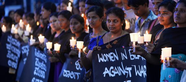 Women hold placards during a silent protest titled Women in Black for Peace on the eve of International Women's Day in Bangalore Women hold placards during a silent protest titled Women in Black for Peace on the eve of International Women's Day in Bangalore - Sputnik International