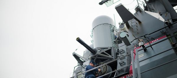 A sailor conducts maintenance on the Phalanx CIWS close-in weapon system aboard the Arleigh Burke-class guided missile destroyer USS Stout at Naval Station Norfolk in Norfolk, Virginia A sailor conducts maintenance on the Phalanx CIWS close-in weapon system aboard the Arleigh Burke-class guided missile destroyer USS Stout at Naval Station Norfolk in Norfolk, Virginia - Sputnik International
