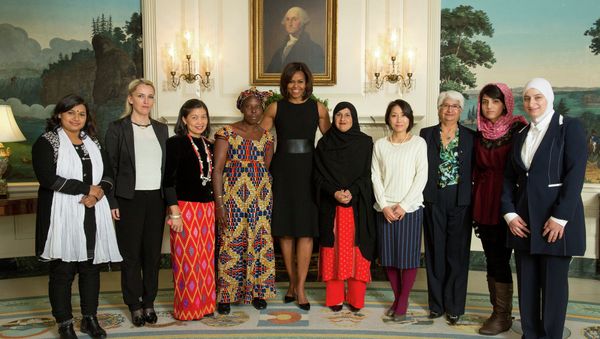 First Lady Michelle Obama greets recipients of the State Department 2015 International Women of Courage Award recipients in the Diplomatic Reception Room of the White House March 7, 2015. From left: Nadia Sharmeen, Bangladesh; Arbana Xharra, Kosovo; May Sabe Phyu, Burma; Marie Claire Tchecola, Guinea; Tabassum Adnan, Pakistan; Sayaka Osakabe, Japan; Rosa Julieta Montano Salvatierra, Bolivia; Captain Niloofar Rahmani; Afghanistan; Majd Chourbaji, Syria. - Sputnik International