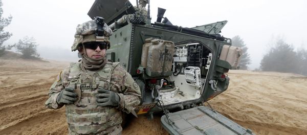 Soldiers of the U.S. Army's 2nd Cavalry Regiment, deployed in Latvia as part of the US Operation Atlantic Resolve, are pictured near their armored vehicle named Stryker during a joint military exercise in Adazi, Latvia Soldiers of the U.S. Army's 2nd Cavalry Regiment, deployed in Latvia as part of the US Operation Atlantic Resolve, are pictured near their armored vehicle named Stryker during a joint military exercise in Adazi, Latvia - Sputnik International