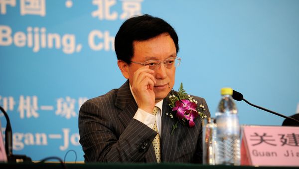 President Guan Jianzhong of Dagong Global Credit Rating reacts as he attends a press conference in Beijing President Guan Jianzhong of Dagong Global Credit Rating reacts as he attends a press conference in Beijing - Sputnik International