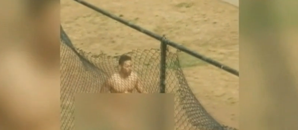 The caller had said a man was “acting deranged, knocking on doors, and crawling around in the ground naked.” The caller had said a man was “acting deranged, knocking on doors, and crawling around in the ground naked.” - Sputnik International