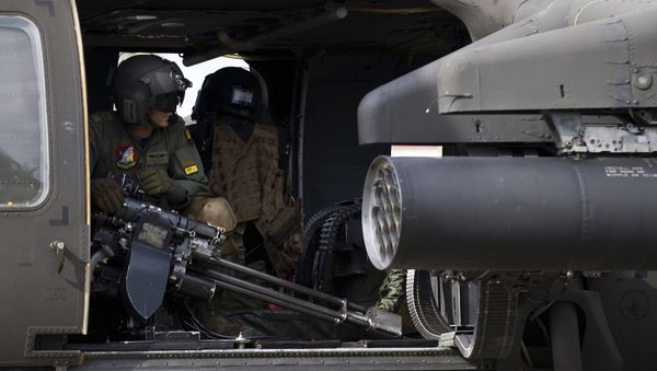 A Colombian Air Force helicopter takes off at a military base in Quibdo, Department of Choco, Colombia, on November 19, 2014, before heading to reinforce search operations of General Ruben Alzate who was kidnapped by the FARC - Sputnik International