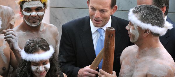 A file photo taken on November 12, 2013, shows Australian Prime Minister Tony Abbott holding his fighting boomerang while talking to an Aboriginal performer at the opening of the 44th Parliament in Canberra. Abbott faced a wave of criticism on March 11, 2015 A file photo taken on November 12, 2013, shows Australian Prime Minister Tony Abbott holding his fighting boomerang while talking to an Aboriginal performer at the opening of the 44th Parliament in Canberra. Abbott faced a wave of criticism on March 11, 2015 - Sputnik International