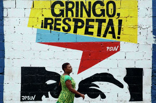 A woman walks past graffiti which reads Gringo, respect us! in Caracas March 10, 2015. President Nicolas Maduro was seeking special decree powers from Venezuela's parliament on Tuesday in response to new U.S. sanctions, drawing opposition protests of a power-grab A woman walks past graffiti which reads Gringo, respect us! in Caracas March 10, 2015. President Nicolas Maduro was seeking special decree powers from Venezuela's parliament on Tuesday in response to new U.S. sanctions, drawing opposition protests of a power-grab - Sputnik International