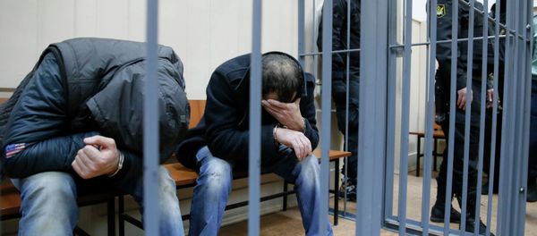 Shagid Gubashev (L) and Ramzan Bakhayev, detained over the killing of Russian opposition figure Boris Nemtsov, hide their faces inside a defendants' cage at a court building in Moscow March 8, 2015 Shagid Gubashev (L) and Ramzan Bakhayev, detained over the killing of Russian opposition figure Boris Nemtsov, hide their faces inside a defendants' cage at a court building in Moscow March 8, 2015 - Sputnik International