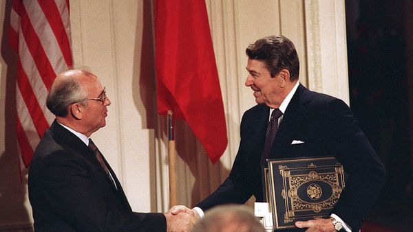 Dec. 8, 1987, file photo, U.S. President Ronald Reagan, right, shakes hands with Soviet leader Mikhail Gorbachev after the two leaders signed the Intermediate Range Nuclear Forces Treaty - Sputnik International