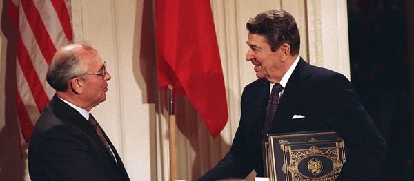 Dec. 8, 1987, file photo, U.S. President Ronald Reagan, right, shakes hands with Soviet leader Mikhail Gorbachev after the two leaders signed the Intermediate Range Nuclear Forces Treaty Dec. 8, 1987, file photo, U.S. President Ronald Reagan, right, shakes hands with Soviet leader Mikhail Gorbachev after the two leaders signed the Intermediate Range Nuclear Forces Treaty - Sputnik International