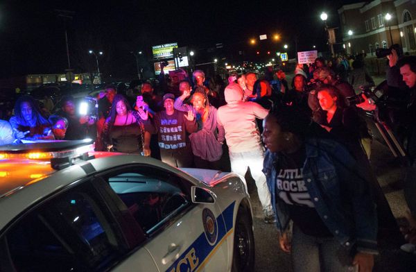 Protestors block a police vehicle from entering the City of Ferguson Police Department and Municipal Court parking lot in Ferguson Missouri, March 11, 2015 - Sputnik International