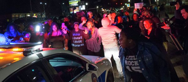 Protestors block a police vehicle from entering the City of Ferguson Police Department and Municipal Court parking lot in Ferguson Missouri, March 11, 2015 Protestors block a police vehicle from entering the City of Ferguson Police Department and Municipal Court parking lot in Ferguson Missouri, March 11, 2015 - Sputnik International