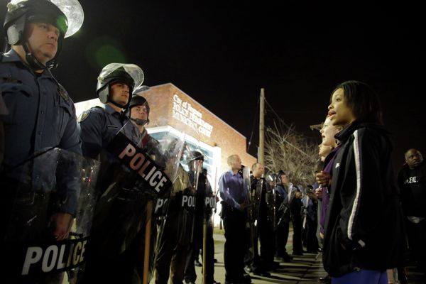 Police and protesters square off outside the Ferguson Police Department, Wednesday, March 11, 2015, in Ferguson, Mo - Sputnik International