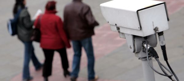 A police CCTV camera observes people walking in the Embankment area of central London A police CCTV camera observes people walking in the Embankment area of central London - Sputnik International
