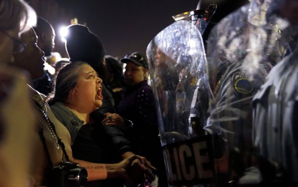 A protester yells at police outside the Ferguson Police Department A protester yells at police outside the Ferguson Police Department - Sputnik International
