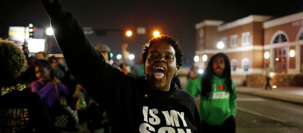 A protestor shouts during a demonstration outside the Ferguson Police Department in Ferguson, Missouri, March 12, 2015 A protestor shouts during a demonstration outside the Ferguson Police Department in Ferguson, Missouri, March 12, 2015 - Sputnik International