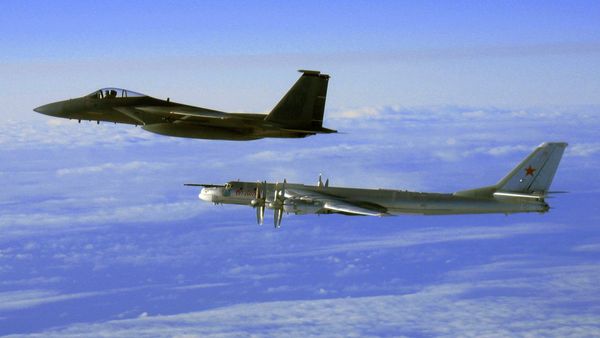 This Thursday, Sept. 28, 2006 file photo provided by the U.S. Air Force shows an F-15C Eagle from the 12th Fighter Squadron at Elmendorf Air Force Base in Anchorage, Alaska, flying next to a Russian Tu-95 Bear bomber, right, during a Russian exercise which brought the bomber near the west coast of Alaska - Sputnik International
