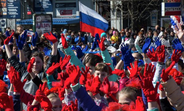 Participants of the Crimean Spring anniversary celebrations march in downtown Simferopol Participants of the Crimean Spring anniversary celebrations march in downtown Simferopol - Sputnik International