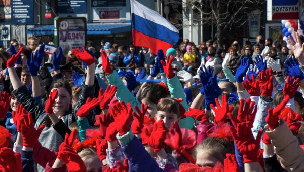 Participants of the Crimean Spring anniversary celebrations march in downtown Simferopol - Sputnik International