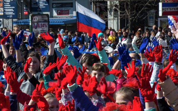 Participants of the Crimean Spring anniversary celebrations march in downtown Simferopol - Sputnik International