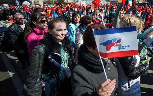 Participants of the Crimean Spring anniversary celebrations march in downtown Simferopol - Sputnik International
