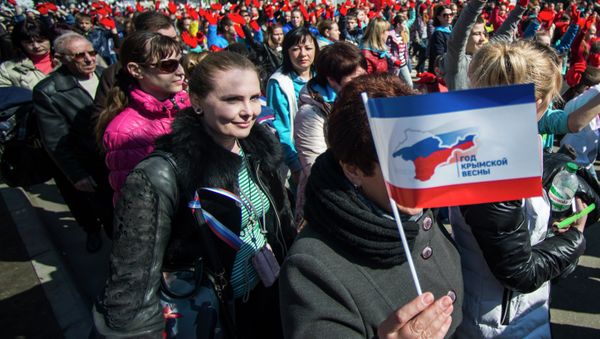 Participants of the Crimean Spring anniversary celebrations march in downtown Simferopol Participants of the Crimean Spring anniversary celebrations march in downtown Simferopol - Sputnik International
