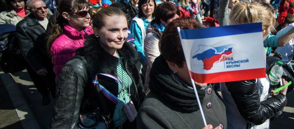 Participants of the Crimean Spring anniversary celebrations march in downtown Simferopol - Sputnik International