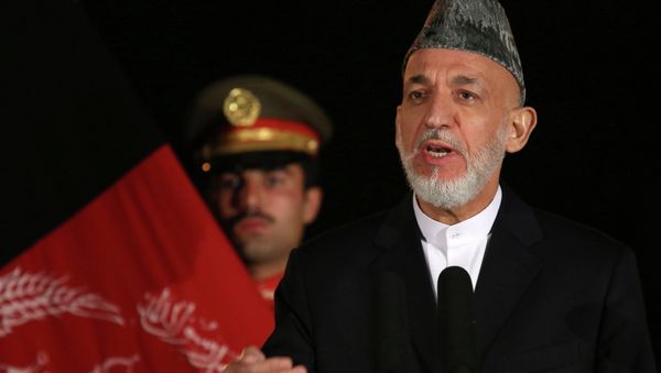 Then-Afghan President Hamid Karzai holds a press conference with U.S. Secretary of State John Kerry at the Presidential Palace on Saturday, Oct. 12, 2013 in Kabul. Kerry and Karzai held talks on the bilateral security agreement. Then-Afghan President Hamid Karzai holds a press conference with U.S. Secretary of State John Kerry at the Presidential Palace on Saturday, Oct. 12, 2013 in Kabul. Kerry and Karzai held talks on the bilateral security agreement. - Sputnik International