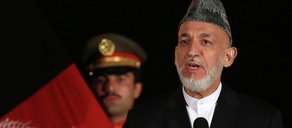 Then-Afghan President Hamid Karzai holds a press conference with U.S. Secretary of State John Kerry at the Presidential Palace on Saturday, Oct. 12, 2013 in Kabul. Kerry and Karzai held talks on the bilateral security agreement. Then-Afghan President Hamid Karzai holds a press conference with U.S. Secretary of State John Kerry at the Presidential Palace on Saturday, Oct. 12, 2013 in Kabul. Kerry and Karzai held talks on the bilateral security agreement. - Sputnik International