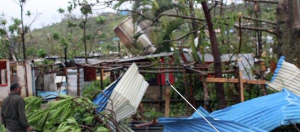 Debris is scattered over a building in Port Vila, Vanuatu, Saturday, March 14, 2015, in the aftermath of Cyclone Pam Debris is scattered over a building in Port Vila, Vanuatu, Saturday, March 14, 2015, in the aftermath of Cyclone Pam - Sputnik International