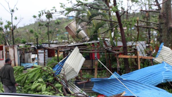Debris is scattered over a building in Port Vila, Vanuatu, Saturday, March 14, 2015, in the aftermath of Cyclone Pam - Sputnik International