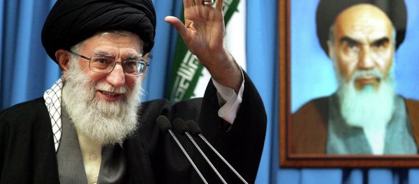 Iranian supreme leader Ayatollah Ali Khamenei waves to the worshippers. Iranian supreme leader Ayatollah Ali Khamenei waves to the worshippers. - Sputnik International