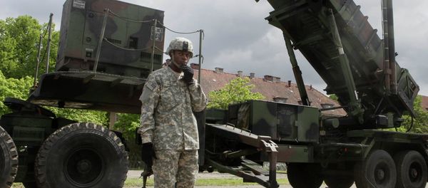 A U.S. soldier stands next to a Patriot surface-to-air missile battery at an army base in Morag, Poland A U.S. soldier stands next to a Patriot surface-to-air missile battery at an army base in Morag, Poland - Sputnik International