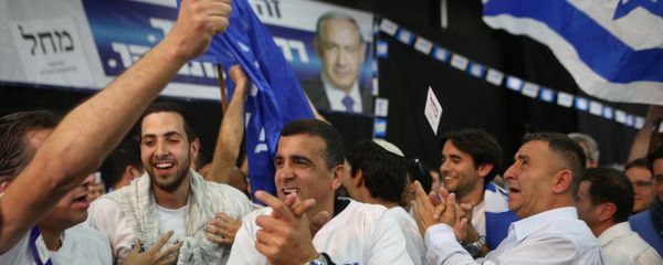 Israeli Likud Party supporters react to the exit polls while they wait for the announcement of the first official results of Israel's parliamentary elections on March 17, 2015 at the party's headquarters in the city of Tel Aviv Israeli Likud Party supporters react to the exit polls while they wait for the announcement of the first official results of Israel's parliamentary elections on March 17, 2015 at the party's headquarters in the city of Tel Aviv - Sputnik International
