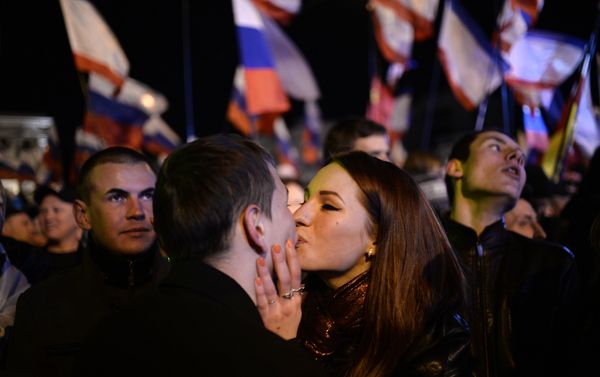 A file picture taken on March 16, 2014 shows a Crimean couple kissing as people celebrate in Simferopol's Lenin Square after exit polls showed that about 93 percent of voters in Ukraine's Crimea region supported union with Russia. A file picture taken on March 16, 2014 shows a Crimean couple kissing as people celebrate in Simferopol's Lenin Square after exit polls showed that about 93 percent of voters in Ukraine's Crimea region supported union with Russia. - Sputnik International