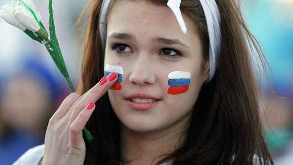 A girl with Russian national flags painted on her cheeks takes part in celebrations marking the one-year anniversary of Crimea voting to leave Ukraine, in central Simferopol March 16, 2015. A girl with Russian national flags painted on her cheeks takes part in celebrations marking the one-year anniversary of Crimea voting to leave Ukraine, in central Simferopol March 16, 2015. - Sputnik International