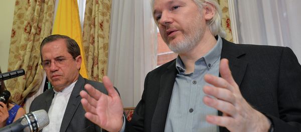 Julian Assange, with Ecuadorian Foreign Minister Ricardo Patiño, said in an Aug. 8 2014 press conference that he would be leaving the embassy soon, though denied he was going to hand himself over to British police. - Sputnik International