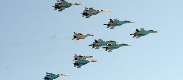 A group of 10 aircraft: Sukhoi 34 aircraft, Sukhoi 27 aircraft and MiG 29 aircraft A group of 10 aircraft: Sukhoi 34 aircraft, Sukhoi 27 aircraft and MiG 29 aircraft - Sputnik International