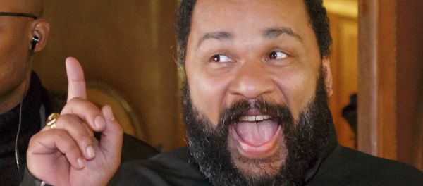 French comedian Dieudonne M'Bala M'Bala gestures to the media as he leaves a Paris court house, Wednesday, Feb. 4, 2015. Controversial French comic Dieudonne has gone on trial charged with defending terrorism in a Facebook post made after the three-day terror spree in Paris last month. - Sputnik International