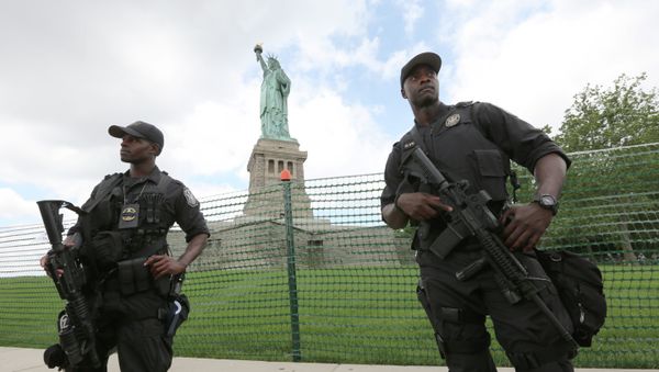 United States Park police swat team members stand guard at the Statue of Liberty in New York United States Park police swat team members stand guard at the Statue of Liberty in New York - Sputnik International